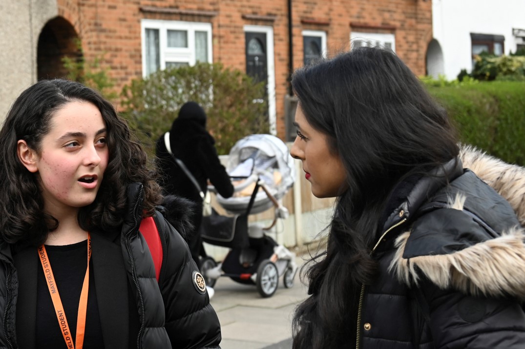 Two ladies talking on the street