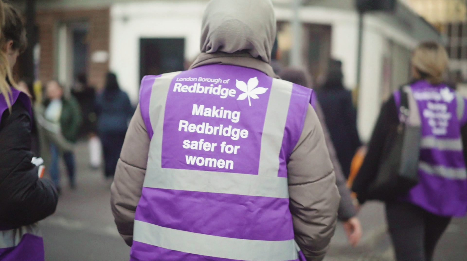Lady walking with a hi vis jacket during a womens saftey walk 